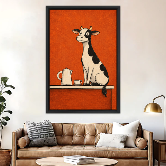 Coffee Counter Cow Canvas Wall Art framed above a brown leather sofa and brass lamp.
