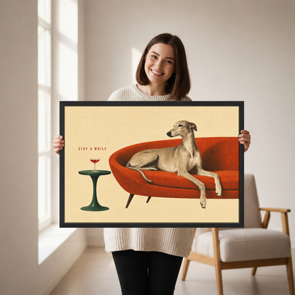Greyhound Stay A While Canvas Wall Art held by a woman in a bright neutral room.
