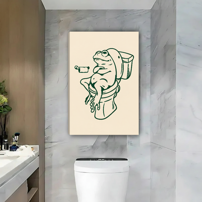 Relaxed Frog Bathroom Break Canvas Wall Art unframed above a toilet against gray marble bathroom walls.