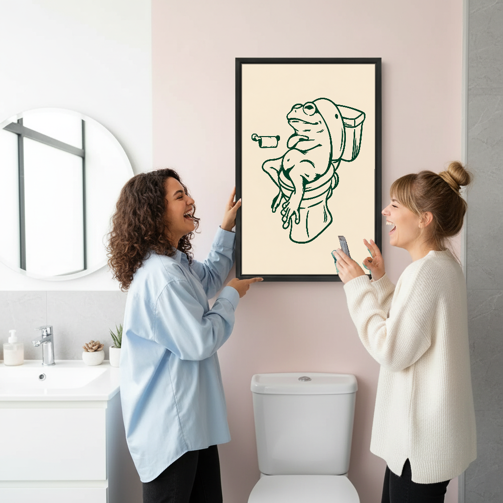 Relaxed Frog Bathroom Break Canvas Wall Art held by two women beside a bathroom mirror and toilet.