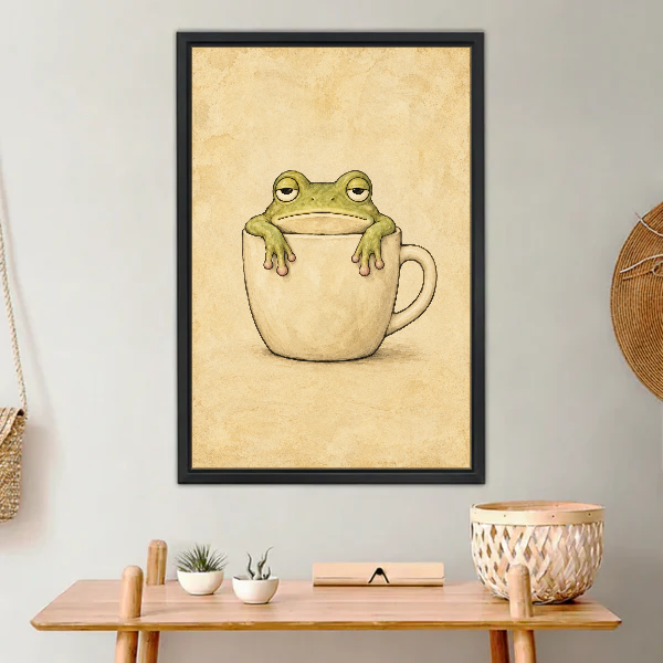 Sleepy Frog Cup Companion Canvas Wall Art framed above a light wood console with cacti.