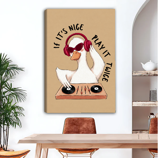 Goose DJ Play It Twice Canvas Wall Art unframed above a wood desk beside a brown chair.
