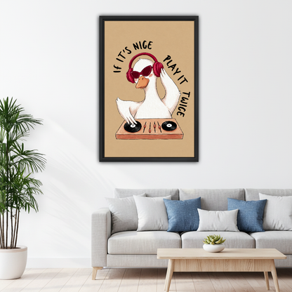 Goose DJ Play It Twice Canvas Wall Art framed above a pale gray sofa with blue cushions.