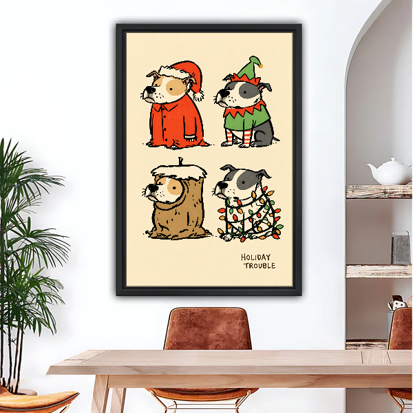 Holiday Trouble Costume Dogs Canvas Wall Art framed above a wood desk beneath a bright archway.