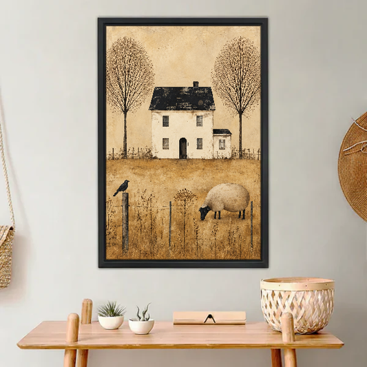 Quiet Country Sheep Cottage Canvas Wall Art framed above a light wood console with cacti.