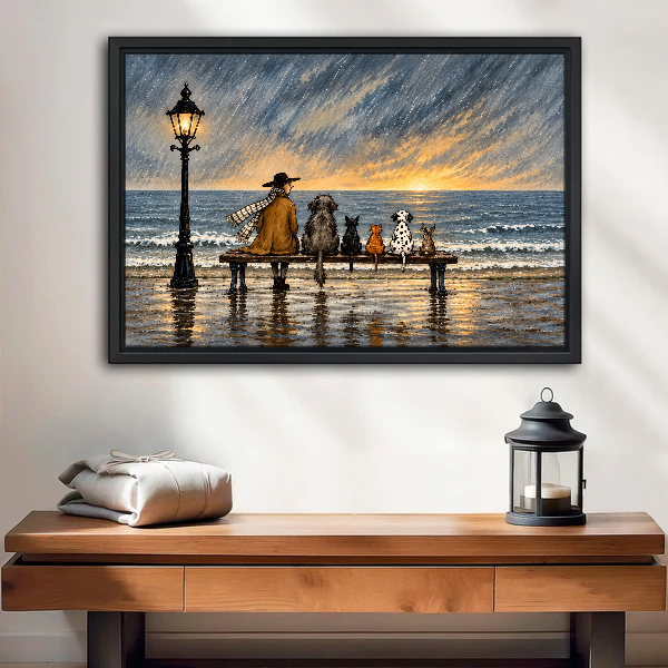 Rainy Seaside Bench Companions Canvas Wall Art framed above a wood console with lantern and folded linen.