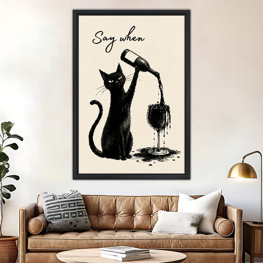 Say When Wine Cat Canvas Wall Art framed above a brown leather sofa and brass lamp.