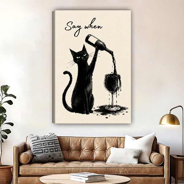 Say When Wine Cat Canvas Wall Art unframed above a brown leather sofa and brass lamp.