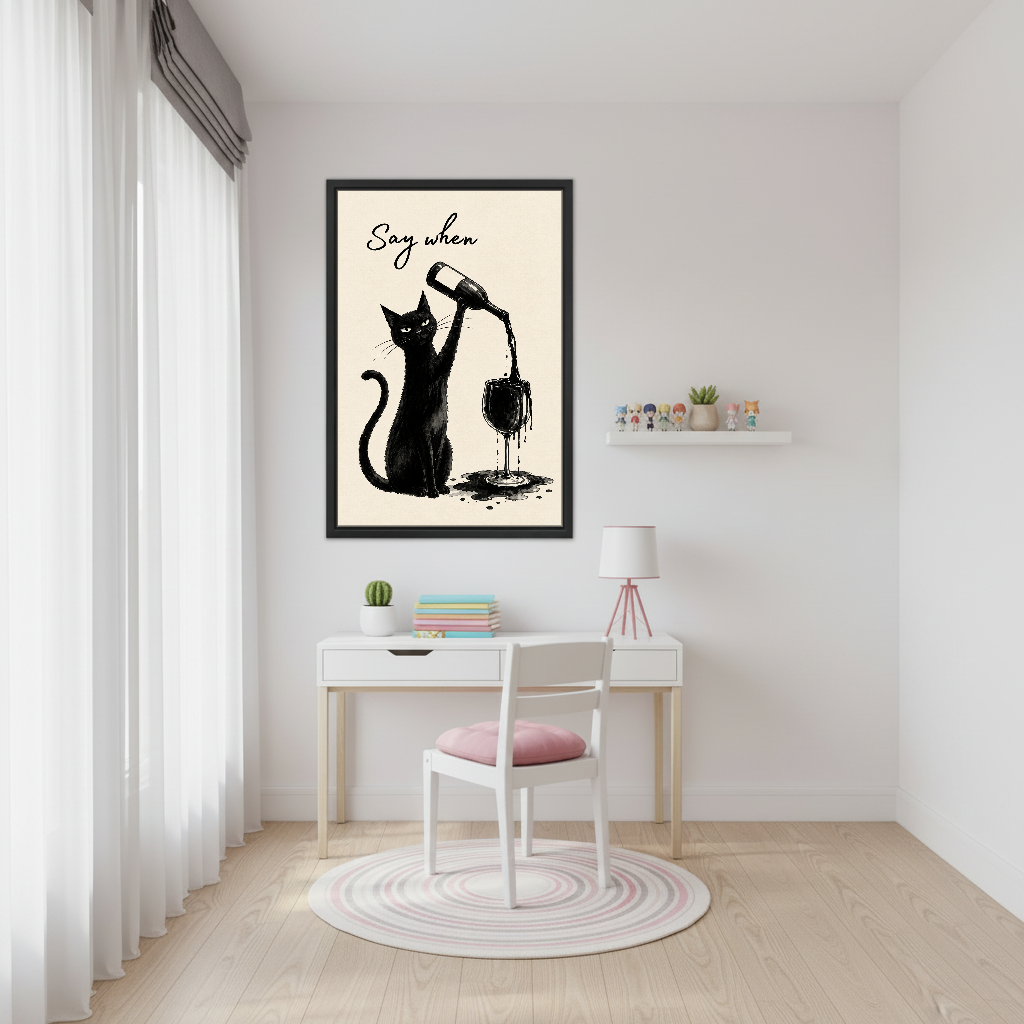 Say When Wine Cat Canvas Wall Art framed above a white desk beside a pale pink chair.
