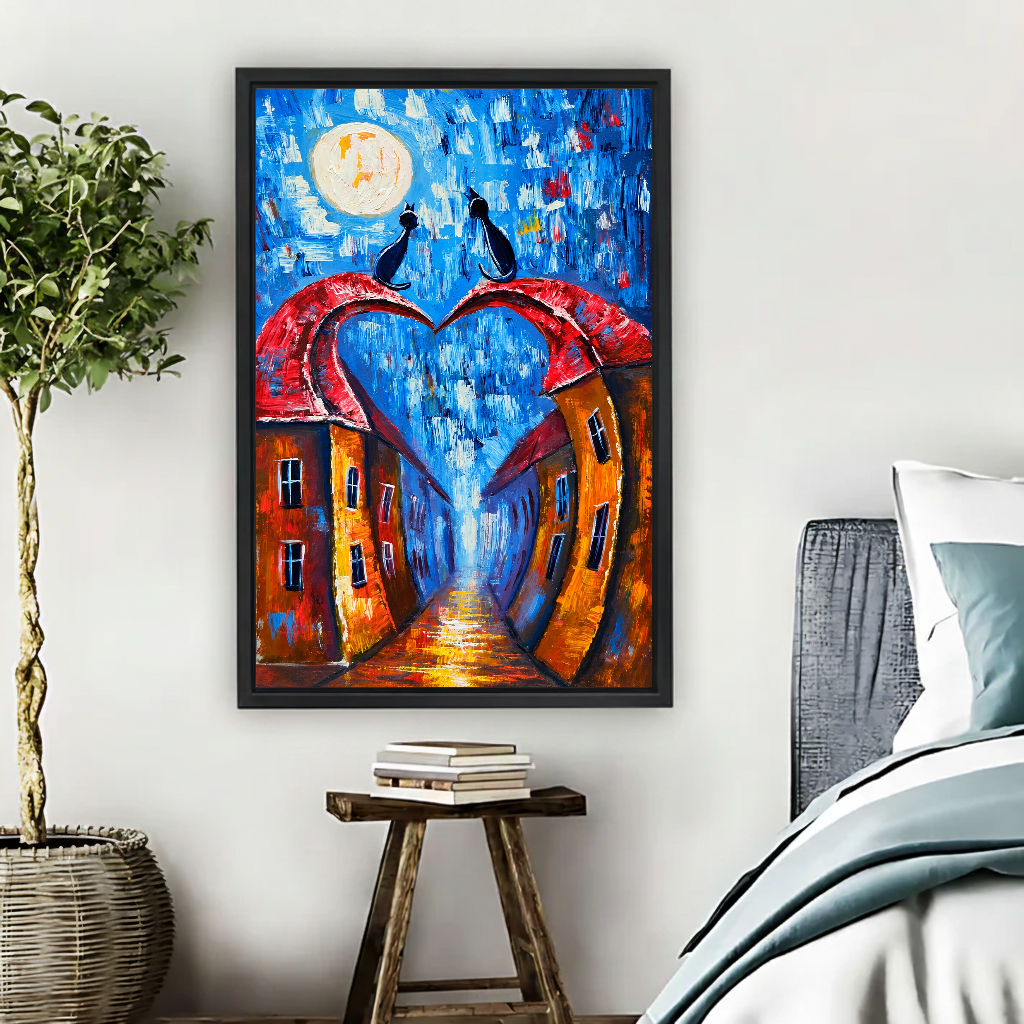 Moonlit Heart Rooftop Cats Canvas Wall Art framed above pale blue bedding beside books and plants.