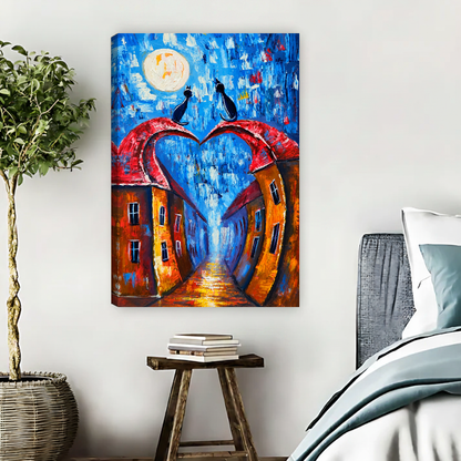 Moonlit Heart Rooftop Cats Canvas Wall Art unframed above pale blue bedding beside a potted tree.