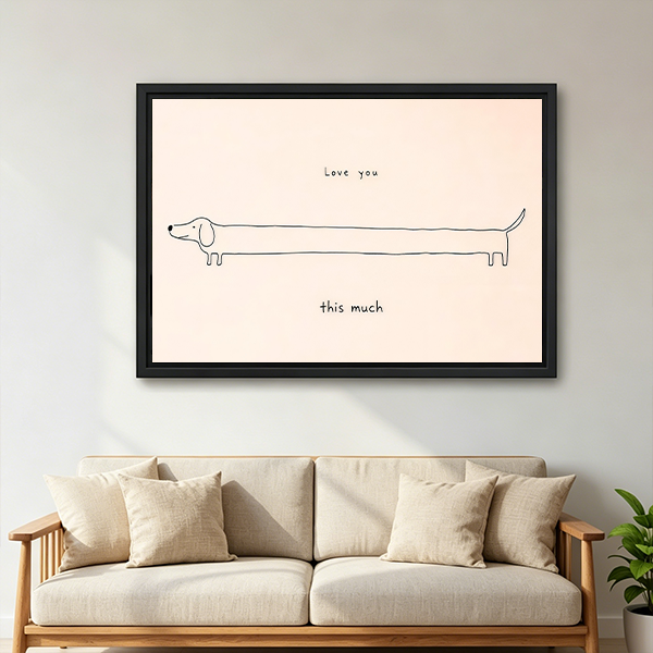 Framed love you this much dachshund canvas wall art with handwritten lettering displayed above a bed with white bedding.