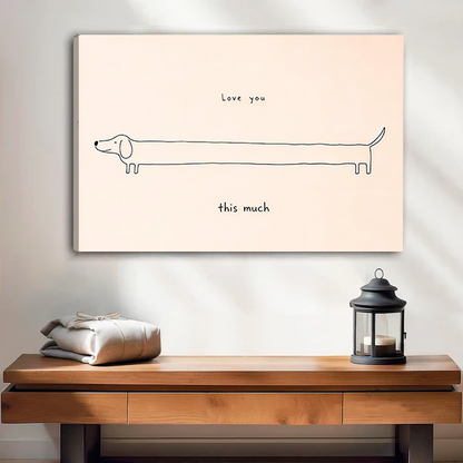 Black-framed love you this much dachshund canvas wall art featuring an elongated dog displayed above a cream sofa.