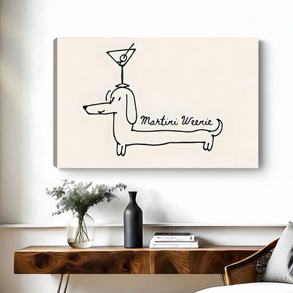 Canvas art print of the Martini Weenie dachshund minimalist line drawing on a beige background, displayed above a wooden console table with greenery