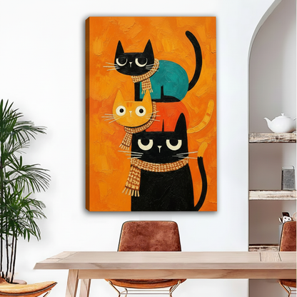 Gallery-wrap stacked cats canvas art featuring three scarf-wearing cats against a textured orange background.