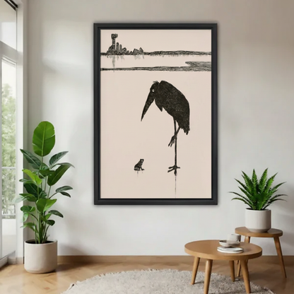 Minimalist bird and frog canvas wall art framed on a clean wall above a wooden table.