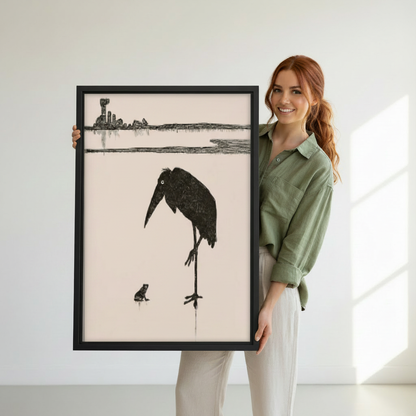 Woman holding minimalist bird and frog canvas wall art to show its framed scale and fine monochrome detail.