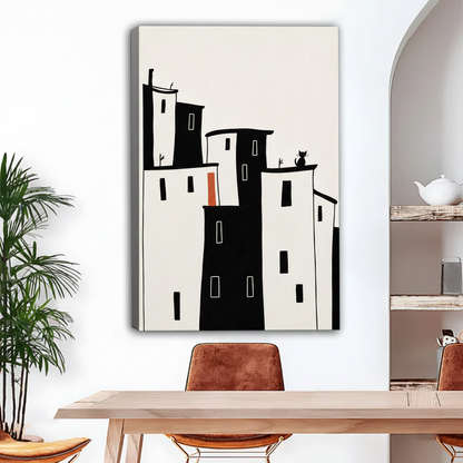 Gallery wrap city cat canvas art with orange accent leaning against wall in dining room
