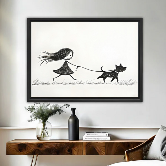 Minimalist black and white girl walking dog framed canvas wall art in black float frame above wooden console