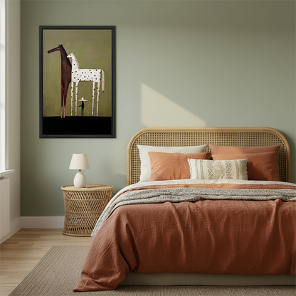 Framed minimalist two horses and figure canvas print displayed beside a rattan bed in a warm terracotta bedroom