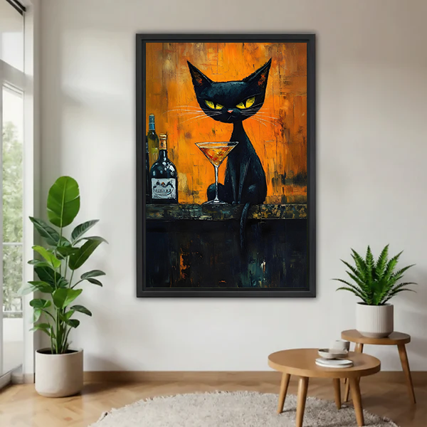 Framed moody black cat cocktail canvas wall art displayed beside green plants in a modern living room
