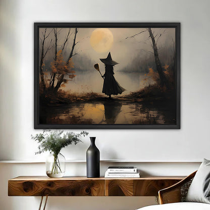 Moody vintage witch moon canvas wall art framed above a walnut console with black vase and books
