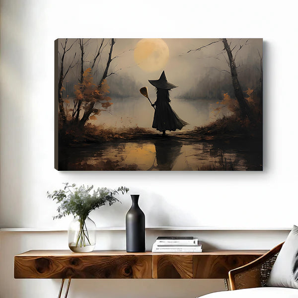 Gallery-wrap moody witch moon canvas wall art showing left canvas edge above a wooden console