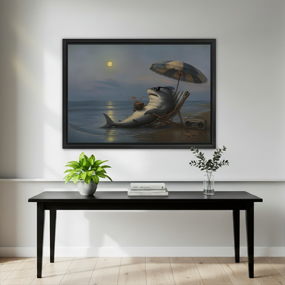 Black-framed moonlit beach shark canvas wall art above a wooden console with flowers, a black vase, and books.