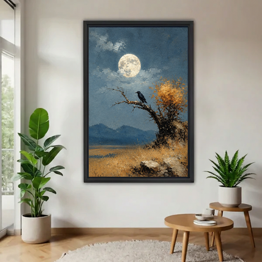 Black-framed moonlit blackbird canvas wall art displayed beside a bright window, leafy plants, and round wooden tables.