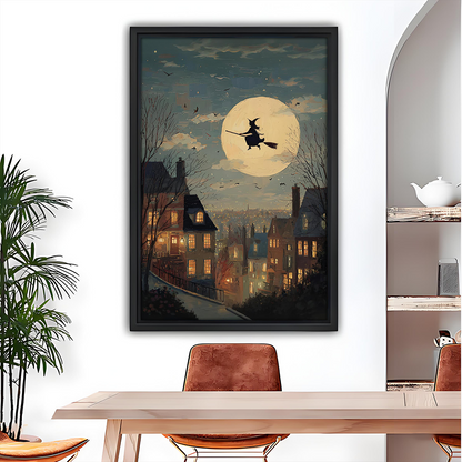 Black-framed moonlit witch canvas wall art featuring a golden full moon and glowing village windows above a dining table.