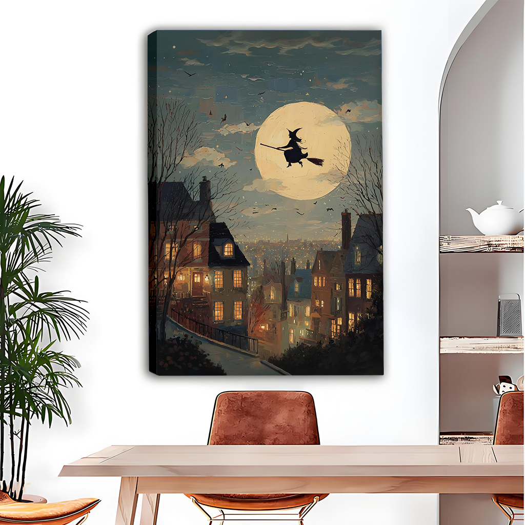 Vintage moonlit witch canvas wall art in a black frame displayed above a gray sofa with blue cushions.