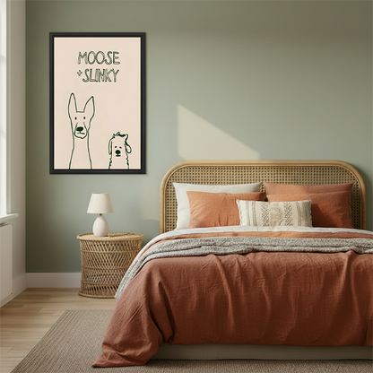 Framed Moose and Slinky dog canvas wall art hanging above a cream sofa in a living room.