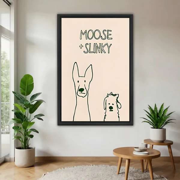 Framed Moose and Slinky dog canvas wall art with simple line-drawn pups between houseplants in a living room.