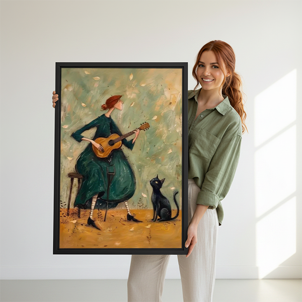 Musical woman and black cat canvas wall art in a black frame above a cream living room sofa.