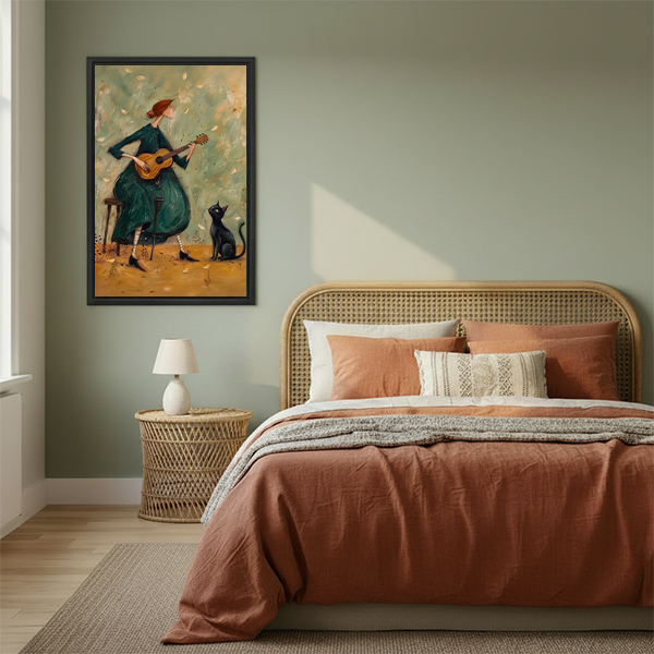 Framed musical woman and black cat canvas wall art beside a rattan bed with rust-colored bedding.