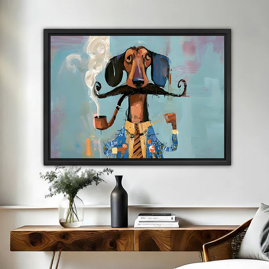 Black-framed mustached dachshund canvas wall art above a wooden console, featuring a blue jacket and turquoise background.