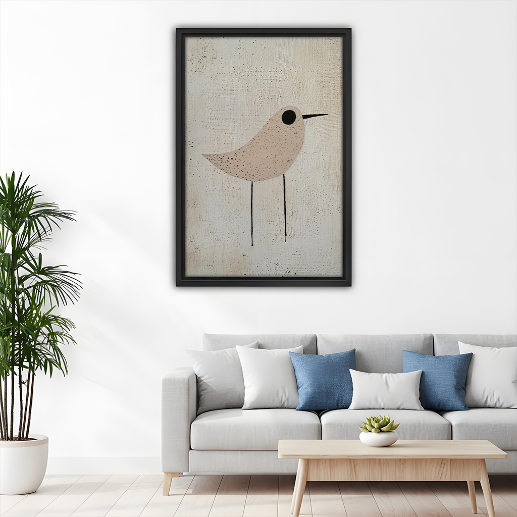 Black-framed neutral bird canvas wall art with beige and cream tones above a wooden dining table.