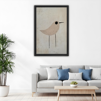 Black-framed neutral bird canvas wall art with beige and cream tones above a wooden dining table.