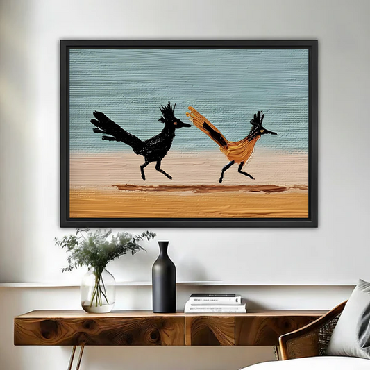 Palette knife running roadrunners canvas wall art in black float frame above wooden console table with black vase and greenery