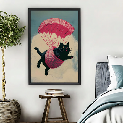 Whimsical parachuting black cat canvas wall art with a pink parachute, black-framed beside a bed and wooden stool.