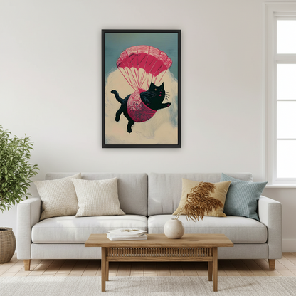 Whimsical parachuting black cat canvas wall art in a black frame above a white and gold home office desk.