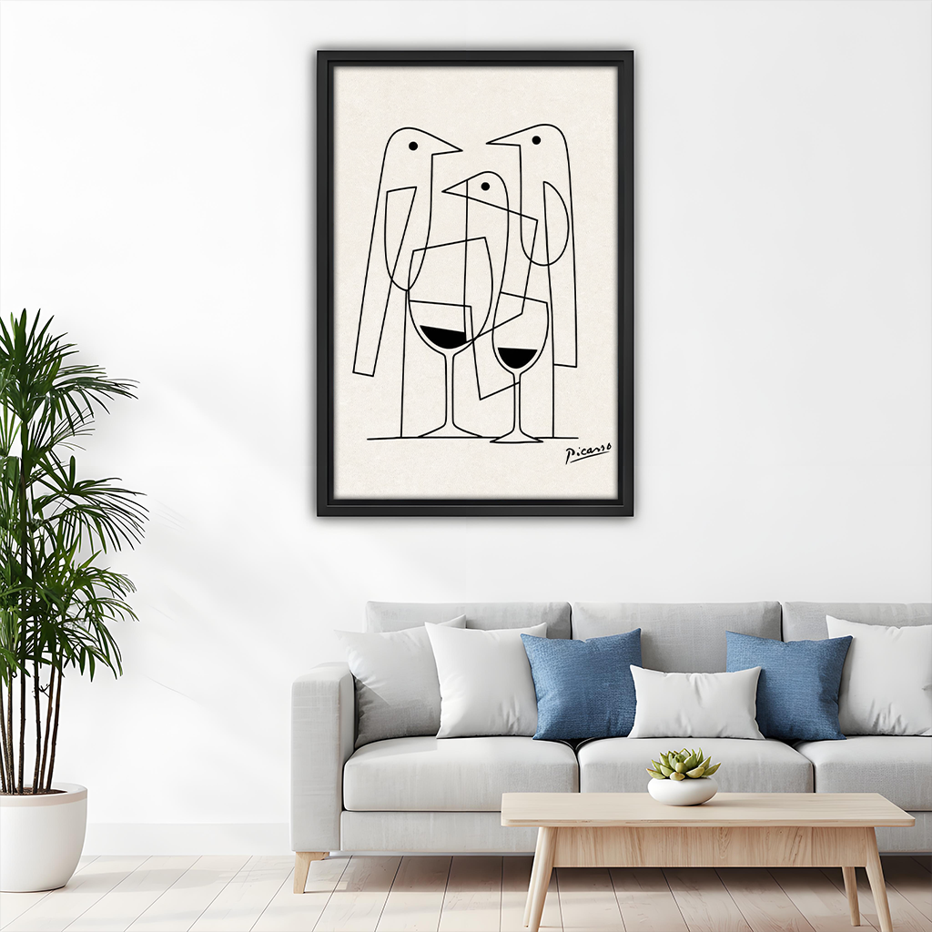 Picasso style line art birds and wine framed canvas wall art above white sofa with blue cushions in minimalist living room