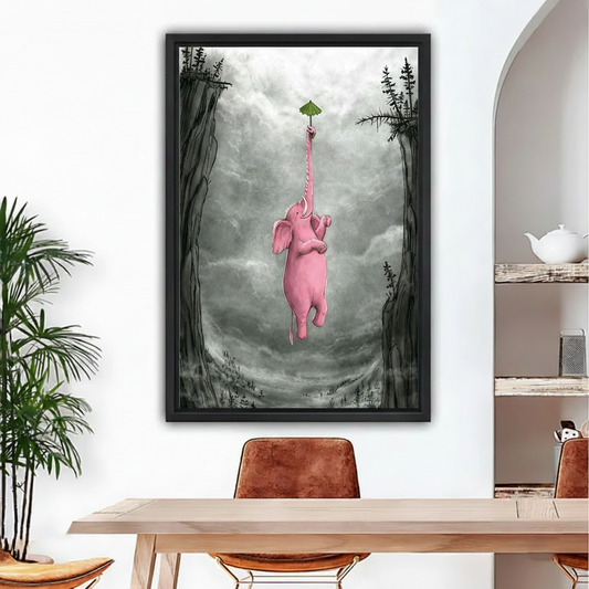 Whimsical pink elephant floating with green umbrella framed canvas wall art above dining table