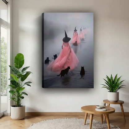 Gallery wrap canvas of pink-dressed witches and black cats in misty fog on white wall with green plants