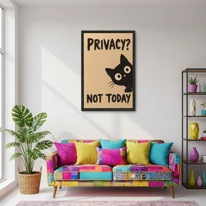 Black cat wall art with “Privacy? Not Today” lettering in a black frame above a colorful patchwork sofa.