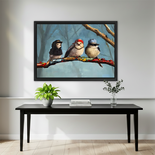 Quirky hip-hop birds framed wall art mounted above a black dining table with minimalist plant decor in a bright interior