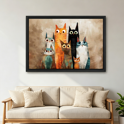 Black framed quirky cat family canvas wall art on a hallway wall above a wood console and lantern
