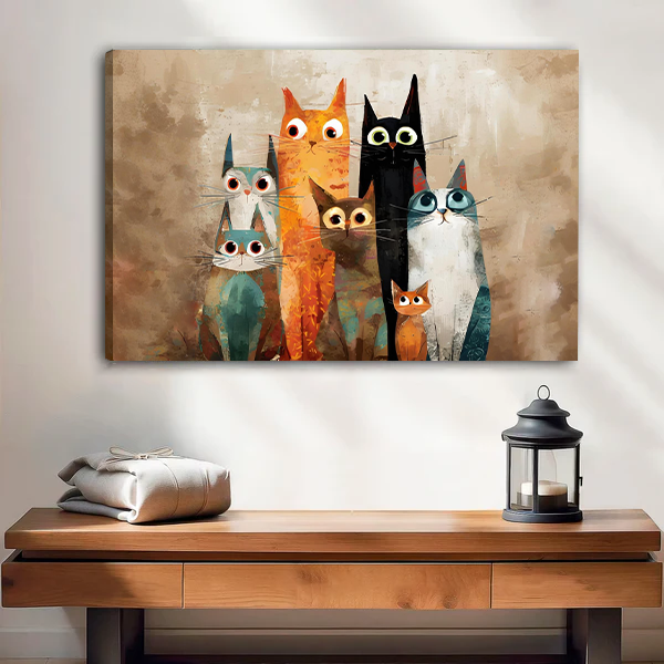 Unframed gallery-wrap quirky cat family canvas wall art above a wooden entryway bench and candle lantern