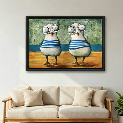 Black framed whimsical seagull beach canvas art styled above a beige linen sofa in a bright Scandinavian living room