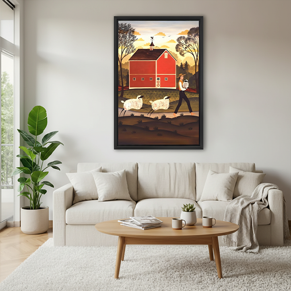 Framed red barn and sheep canvas wall art above a cream sofa in a living room.